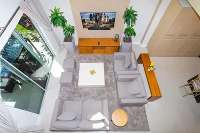 an overhead view of a living room with palm trees at Marvelous 4 Bd Close to Disney @ Magic Village 3153 in Orlando