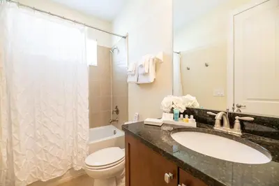 a bathroom with a sink and a toilet and a shower at Gorgeous Home With Media, Disney Themed Kids Room Near Disney With Waterpark & Resort Access At Encore Resort - 771La in Kissimmee