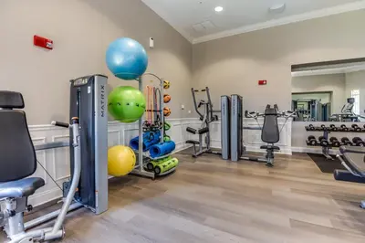 a gym with cardio equipment and exercise bikes at Luxury PET FRIENDLY Condo, Near Clubhouse & Pool in Orlando