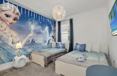 a bedroom with a mermaid mural on the wall at American Secret 10 BED 7 Miles to Disney in Kissimmee
