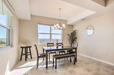 a dining room with a table and chairs at 6 Mi to Disney Resort Hideaway with Pool Access! in Kissimmee