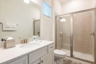 a bathroom with a shower and a toilet and a sink at Blue Sky Cottage Near Disney With Private Pool & Margaritaville Resort And Island H20 Waterpark Access - 2912Sr in Orlando