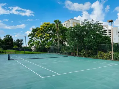 a tennis court with a net on it at NEW - remodeled Studio close to Universal Studios in Orlando