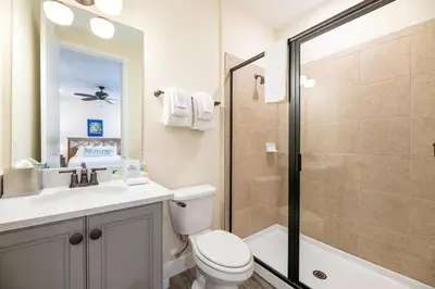 a bathroom with a toilet sink and a shower at Cozy Cottage Near Disney With Margaritaville Resort & Island H20 Waterpark Access - 3009La in Orlando