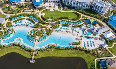 an aerial view of the pool at the resort at Cozy Cottage Near Disney With Margaritaville Resort & Island H20 Waterpark Access - 3009La in Orlando