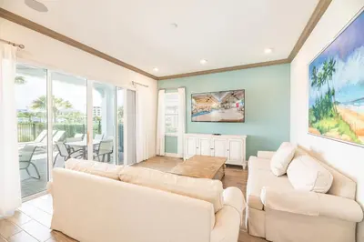 a living room with two white couches and a table at Brilliant Cottage Near Disney With Private Pool & Margaritaville Resort & Island H20 Waterpark Access - 3080Ph in Orlando