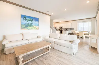 a living room with two white couches and a table at Brilliant Cottage Near Disney With Private Pool & Margaritaville Resort & Island H20 Waterpark Access - 3080Ph in Orlando