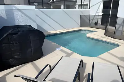 a swimming pool in the middle of a building at Storey Lake home close to Disney and other parks in Kissimmee