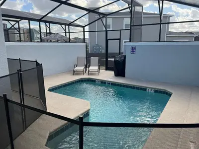 a swimming pool on top of a building at Storey Lake home close to Disney and other parks in Kissimmee