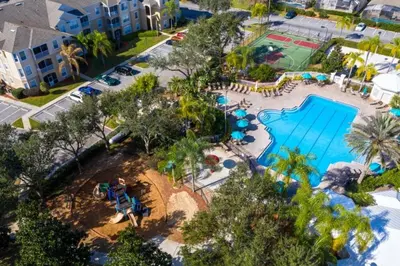 an aerial view of a pool at a resort at Spacious 3 bed, 2 bath Condo in Gated Community condo in Kissimmee