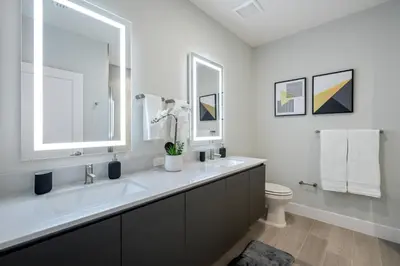 a white bathroom with a sink and a toilet at Hidden Forest 3 Bedroom Vacation Home 2020 in Clermont