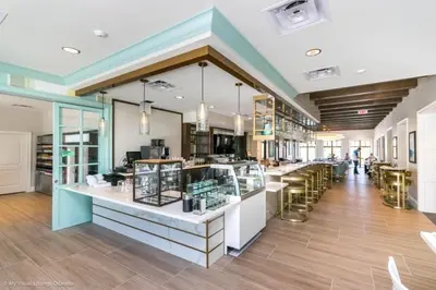 a store with tables and chairs in a room at Orlando Newest Resort Community Town Home townhouse in Orlando