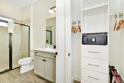 a bathroom with a toilet and a sink at Inviting Cottage With Private Pool Near Disney With Margaritaville Resort & Island H2O Access - 8022Kd in Orlando