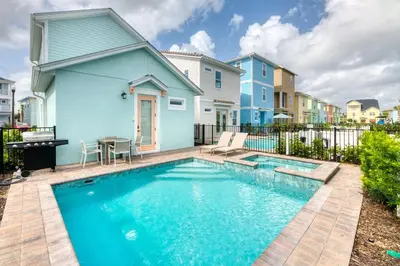 a swimming pool in front of a house at Chat Eau Champagne Cottage With Private Pool Near Disney With Margaritaville Resort & Island H2O Access - 8030Kd in Orlando