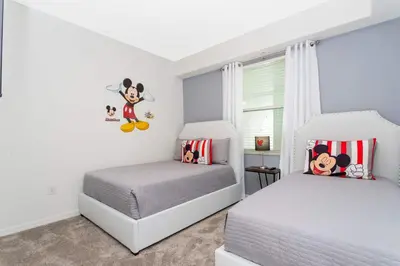a bedroom with two beds and a window at Stunning 2 Bedroom Apartment Close to Disney 304 3191 in Kissimmee