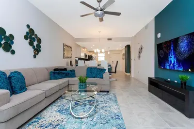 a living room with a couch and a flat screen tv at Gorgeous 2 Bedroom Apartment Close to Disney 305 31911 in Kissimmee