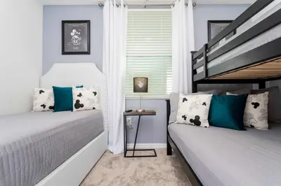 a bedroom with two bunk beds and a window at Gorgeous 2 Bedroom Apartment Close to Disney 305 31911 in Kissimmee