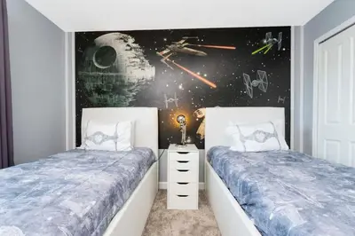 a bedroom with two twin beds and a space mural at Gorgeous 4 Bd w/ Pool Close to Disney @ Storey Lake 2963 in Kissimmee
