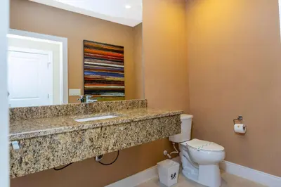 a bathroom with a sink and a toilet at Stunning 4 Bd Close To Disney @ Magic Village 3247 in Orlando