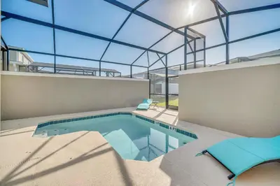 an indoor swimming pool in a building with a glass ceiling at 4200 Paragraph Drive in Kissimmee