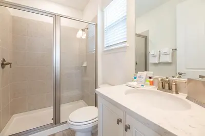 a bathroom with a toilet and a shower and a sink at Seaweed Paradise Cottage Near Disney With Margaritaville Resort & Island H2O Access - 8057Kd in Orlando