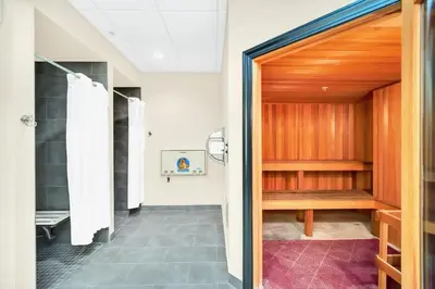 a hallway with a door leading into a bathroom at Bright 2BR Condo with Pool - near Disney! in Orlando