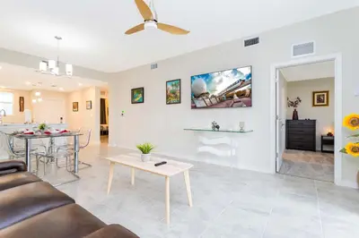 a living room with a couch and a table at Stunning 2Bd Apto Close to Disney @ Storey Lake 105P 3171 in Kissimmee