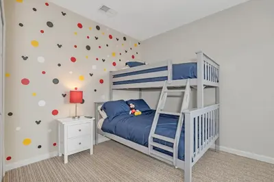 a bedroom with a bunk bed with a climbing wall at -Relaxing 3BR Near Disney - Pool in Orlando