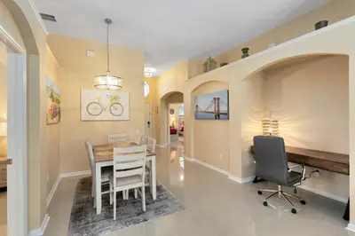 a dining room with a table and chairs at Amazing Disney Dream Getaway in Windsor Palms! villa in Kissimmee