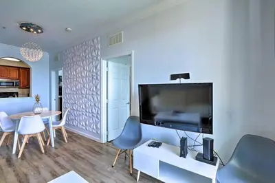 a living room with a large flat screen tv at SeaworldDisneyUniversal Villa 5 beds 3 bed2bath in Orlando