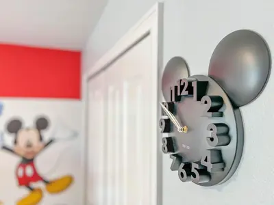 a clock on a door with a mickey mouse on it at Storey Lake Pool Mins to Disney 4BR Games in Kissimmee