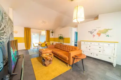 a living room with a couch and a table at Newly Updated 3 Bedroom Home in Kissimmee