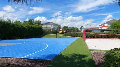 a backyard with a basketball court and a playground at 7500 Marker av in Orlando