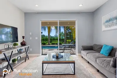 a living room with a couch and a table at 361 Pendant ct in Orlando
