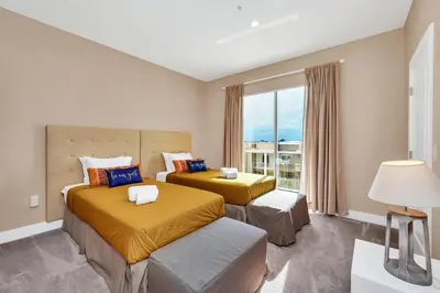 a hotel room with two beds and a window at Luxury Villa Less Than A Mile From Disneyworld -Bonus Elevator- in Orlando