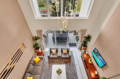 an overhead view of a living room with a chandelier at Luxury Villa Less Than A Mile From Disneyworld -Bonus Elevator- in Orlando