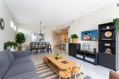 a living room with a couch and a table at Gorgeous 3Bd 2Ba Apt Close to Disney @ Storey Lake Orlando 208 3180 in Kissimmee