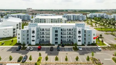 an aerial view of a large white building at Gorgeous 3Bd 2Ba Apt Close to Disney @ Storey Lake Orlando 208 3180 in Kissimmee