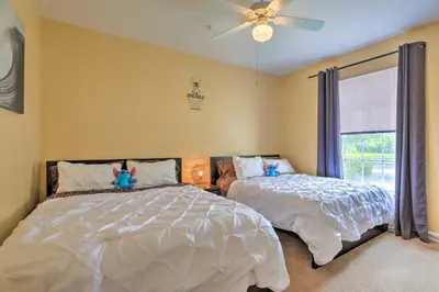 a bedroom with two beds and a ceiling fan at Sun-Soaked Kissimmee Gem with Resort Amenities! in Kissimmee
