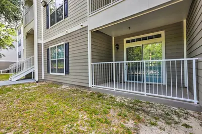 a house with a balcony and a door at Sun-Soaked Kissimmee Gem with Resort Amenities! in Kissimmee