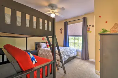 a childs bedroom with a bunk bed and a window at Sun-Soaked Kissimmee Gem with Resort Amenities! in Kissimmee