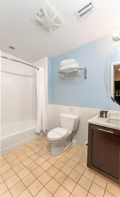 a bathroom with a toilet and a sink and a tub at Hotel Apt at Celebration 10 min from Disney MH225 in Orlando