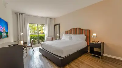 a hotel room with a bed and a window at Hotel Apt at Celebration 10 min from Disney MH225 in Orlando
