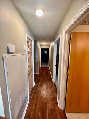 a hallway of a home with wooden floors at Grand Villas of Island 3BR Condo near Disney Parks and Universal in Kissimmee