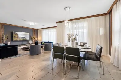 a dining room with a table and chairs at Sophisticated 6BR at Storey Lake SL2766 in Kissimmee