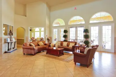 a large living room with couches and tables and windows at Ground Floor Gathering up to 9 guests BL387 in Kissimmee