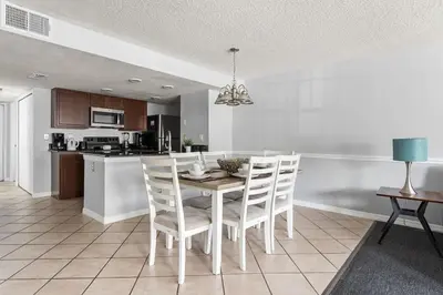 a kitchen with a table and chairs in a kitchen at Enjoy Disney 3BRs at Villas of Somerset VS2745 in Kissimmee