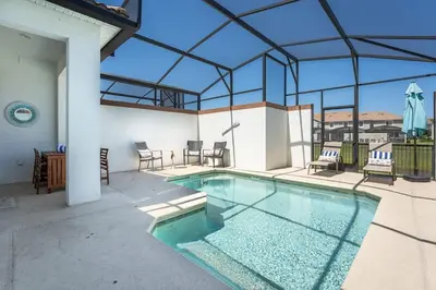 a swimming pool in the middle of a house at Disney Familly Lovers up to 11 SL4928 in Kissimmee