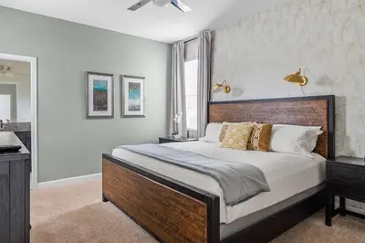 a bedroom with a large bed and a window at 5BR Themed Bedrooms at Storey Lake SL4702 in Kissimmee