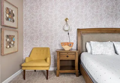 a bedroom with a bed and a chair and a table at 5BR Themed Bedrooms at Storey Lake SL4702 in Kissimmee